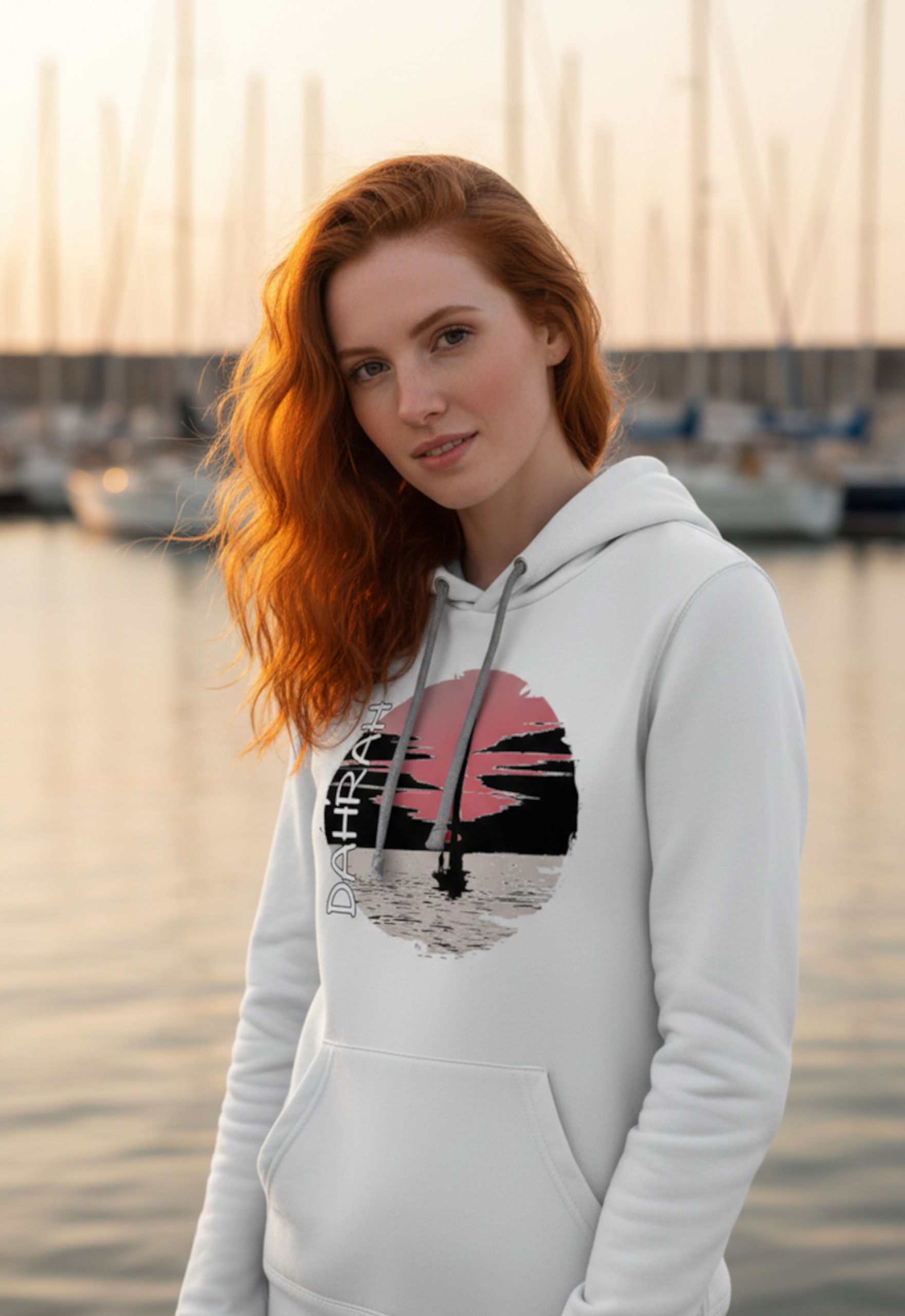 Sailing hoodie with sailing boat at sunset.