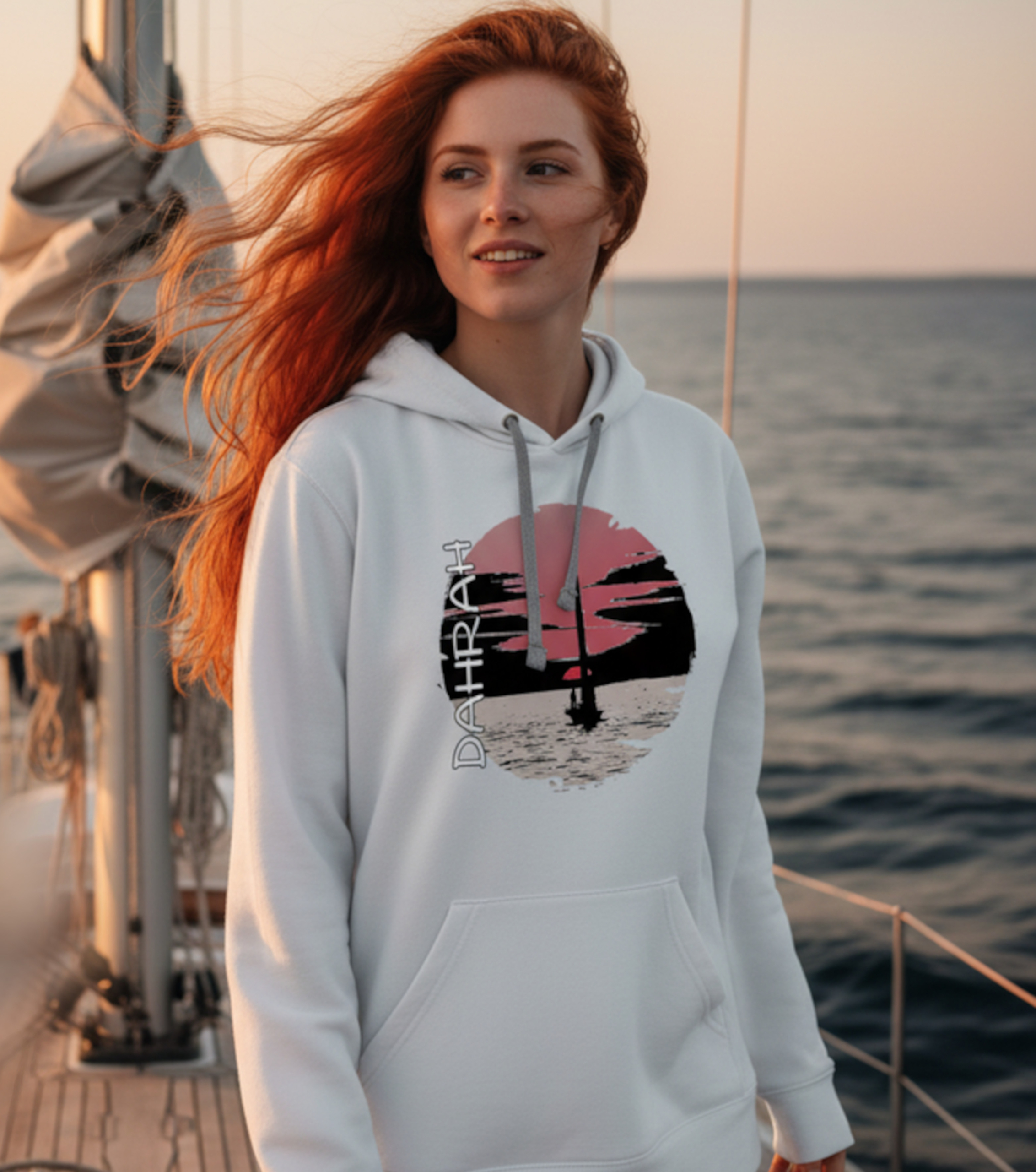 Sailing hoodie with sailing boat at sunset.